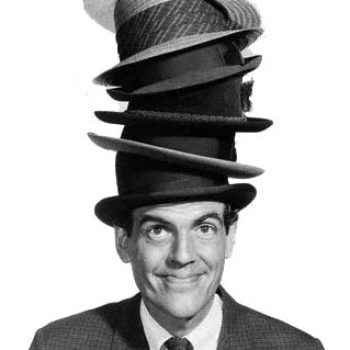 Smiling Man wearing many hats